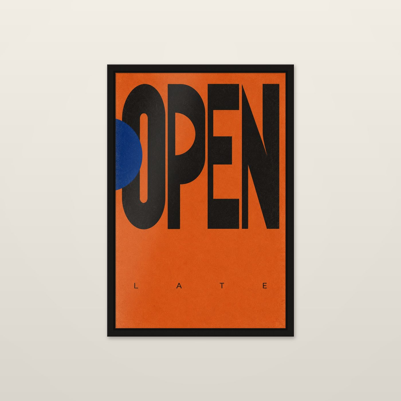 Open Late by OVREL, framed in black and hung on a wall. OPEN set huge in black on orange with a cobalt circle.