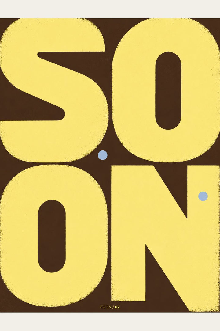 Soon — the word SOON in yellow on dark brown with two small blue dots; art print, unframed